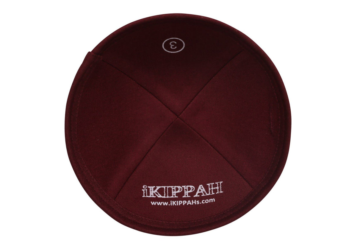 A grey iKIPPAH brand yarmulke with a stylish burgandy lower edge rim inside view.