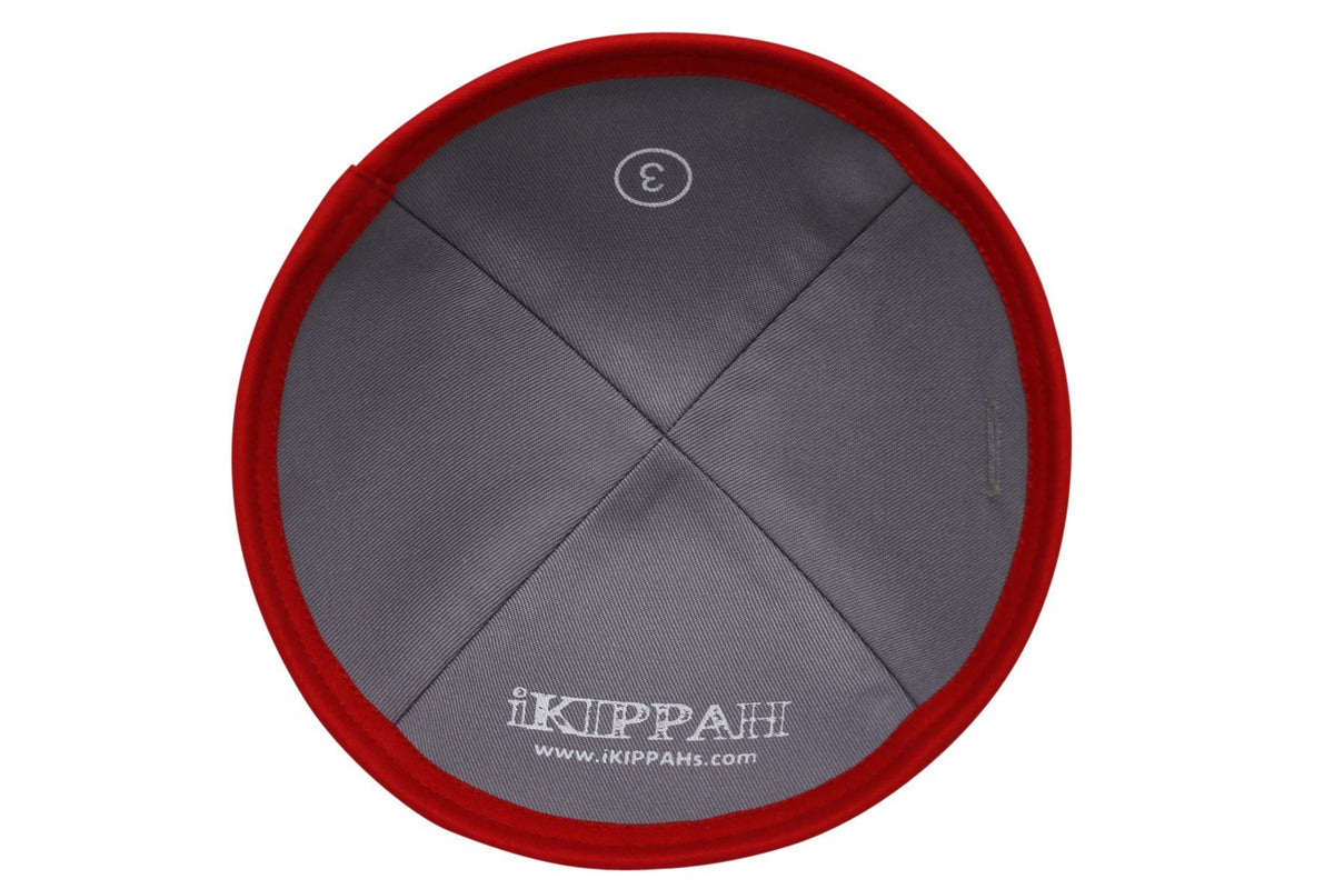 A bright red iKIPPAH brand yarmulke in quality cotton fabric inside view.