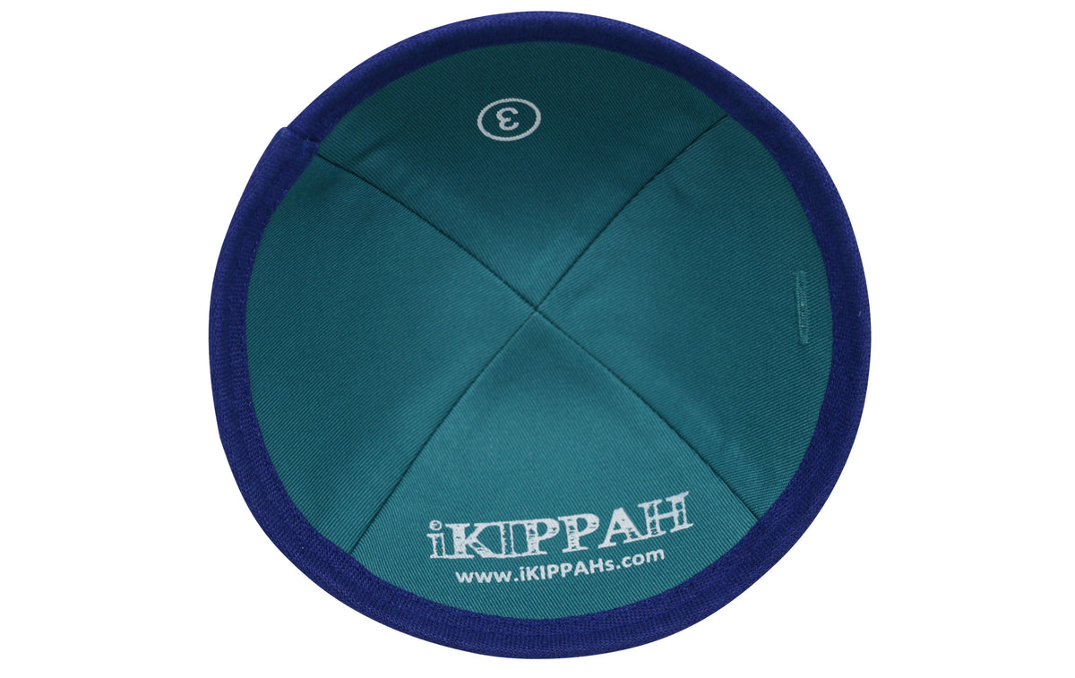 A bright royal blue iKIPPAH brand yarmulke inside view.