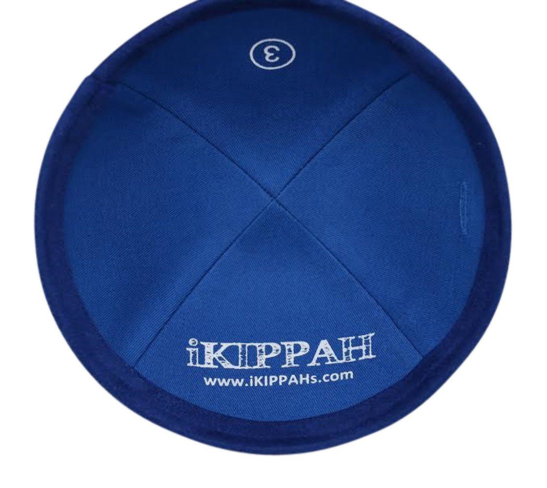 Royal blue suede iKIPPAH brand yarmulke inside view with label.
